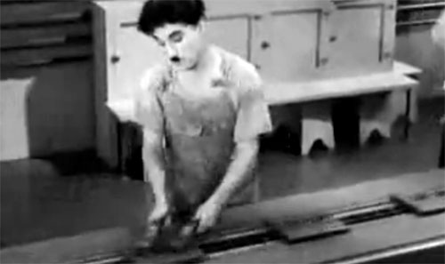 Charlie Chaplin working on the assembly line